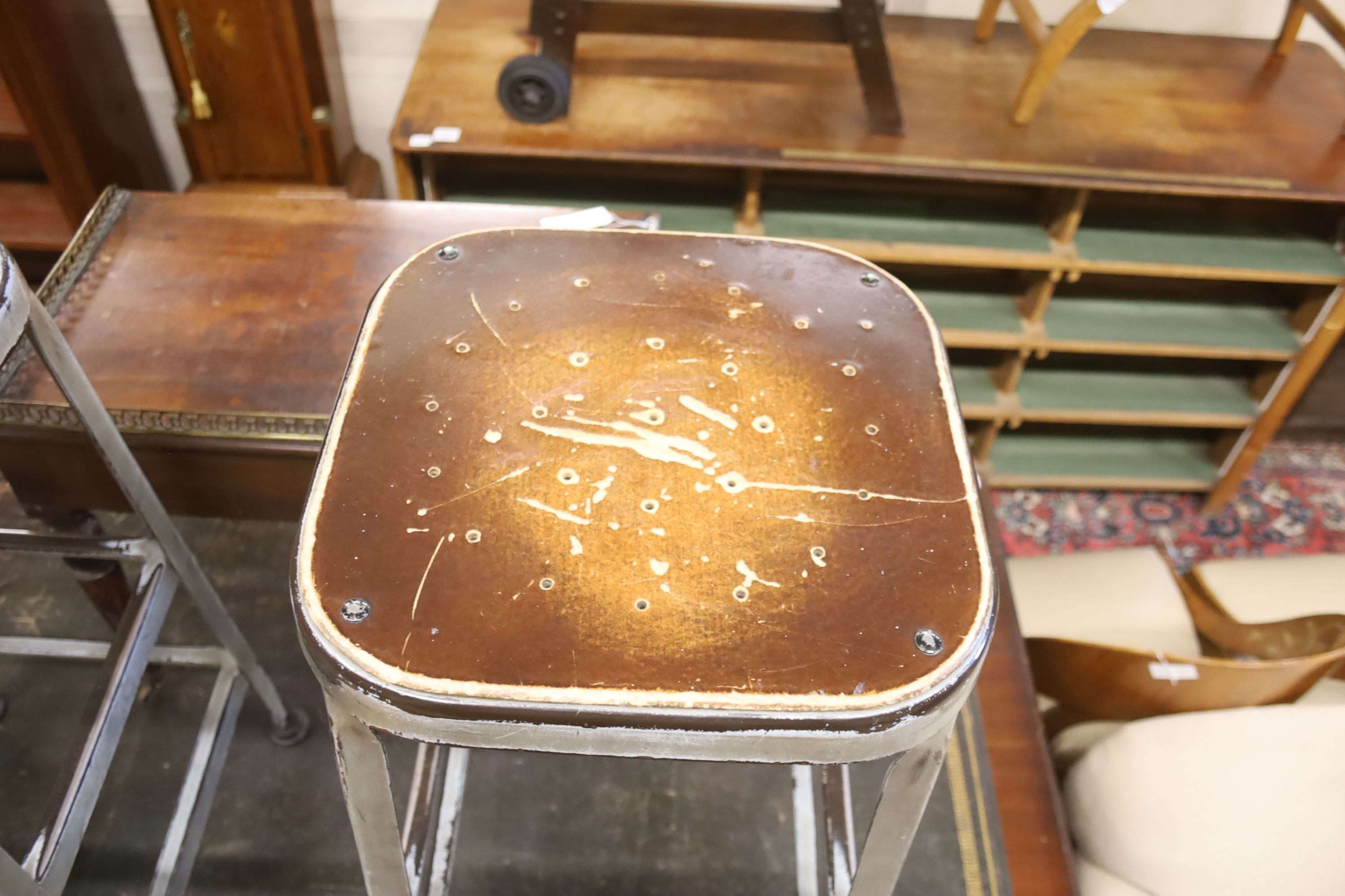 A pair of industrial style steel stools, height 74cm